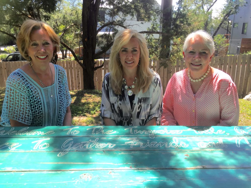 Three women collaborate to bring the Turquoise Table to their office building courtyard. Coworkers make awesome Front Yard People.